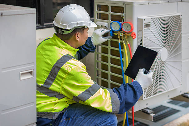 Professional Heat Pump Repair technician working in Wampsville, NY